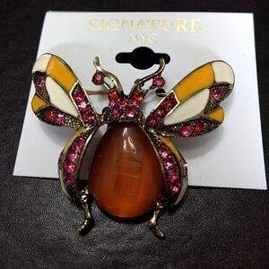 Signature NYC gold tone bug brooch
